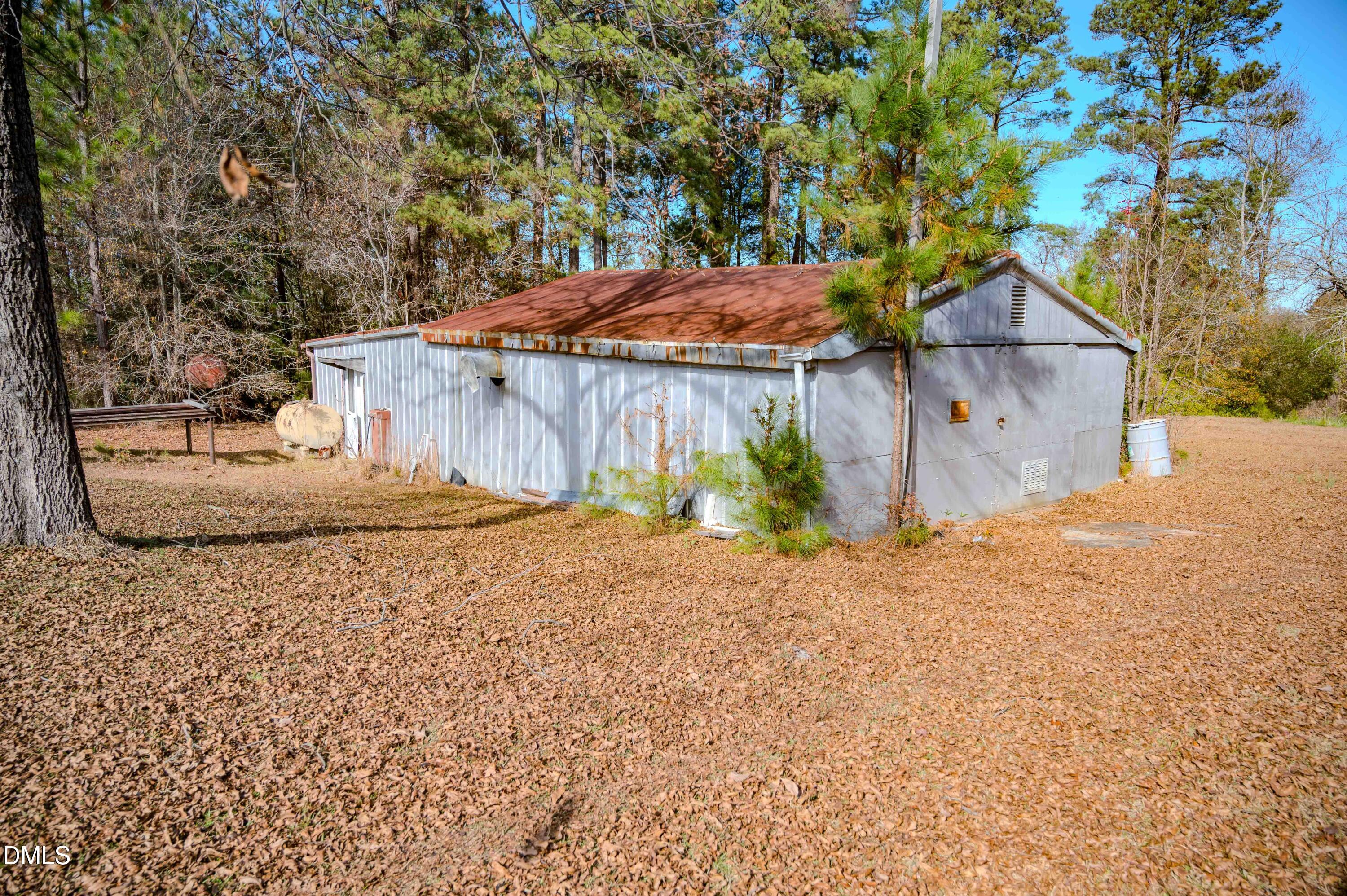 5131 Ponderosa Road Sanford, NC 27332 - Photo 40 of 51 a backyard of a house with a tree and fence