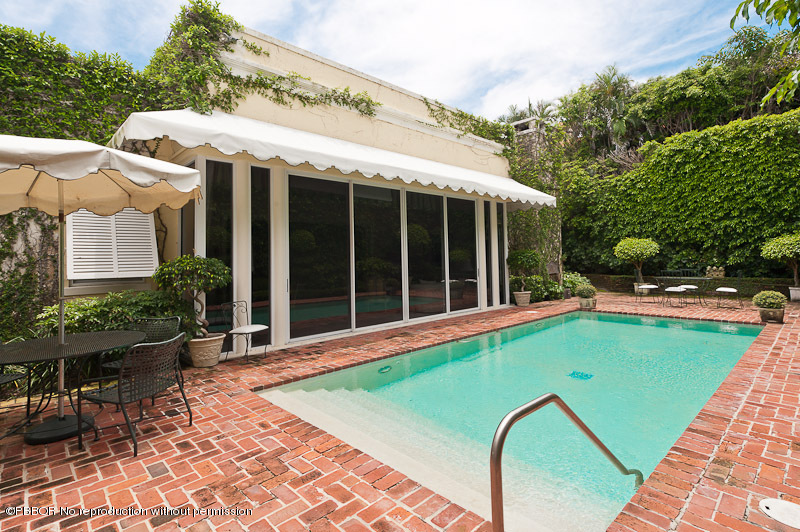 66 Middle Road Palm Beach, FL 33480 - Photo 6 of 11 a view of a house with backyard sitting area and garden