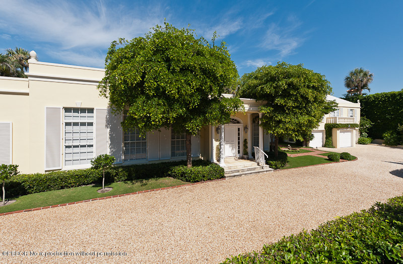 66 Middle Road Palm Beach, FL 33480 - Photo 8 of 11 a front view of a house with a yard and a garage