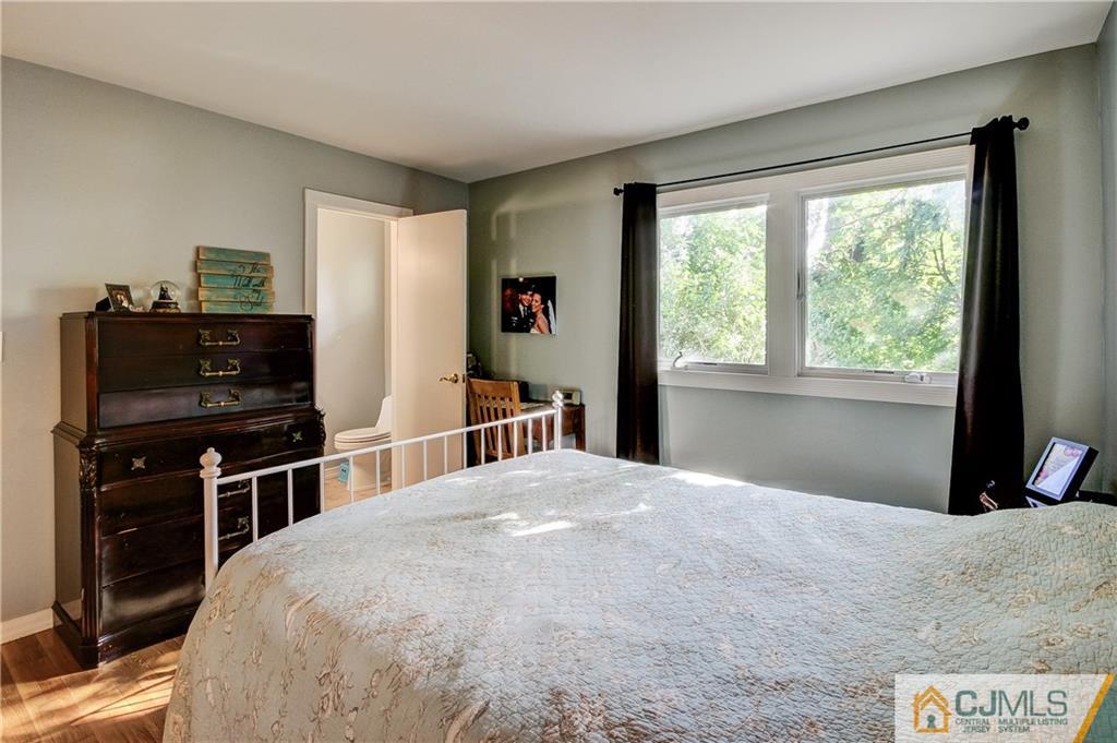 24 Princeton Road Old Bridge, NJ 08859 - Photo 14 of 25 a bedroom with a bed and a large window