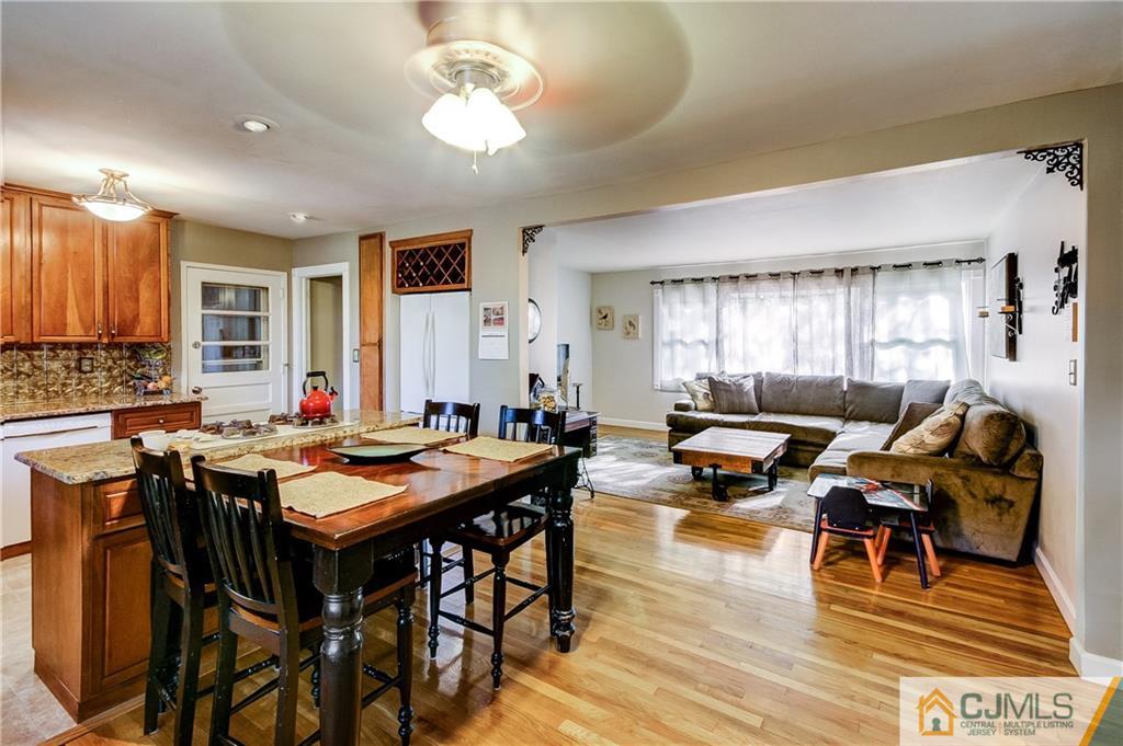 24 Princeton Road Old Bridge, NJ 08859 - Photo 8 of 25 a living room with furniture a wooden floor and a window