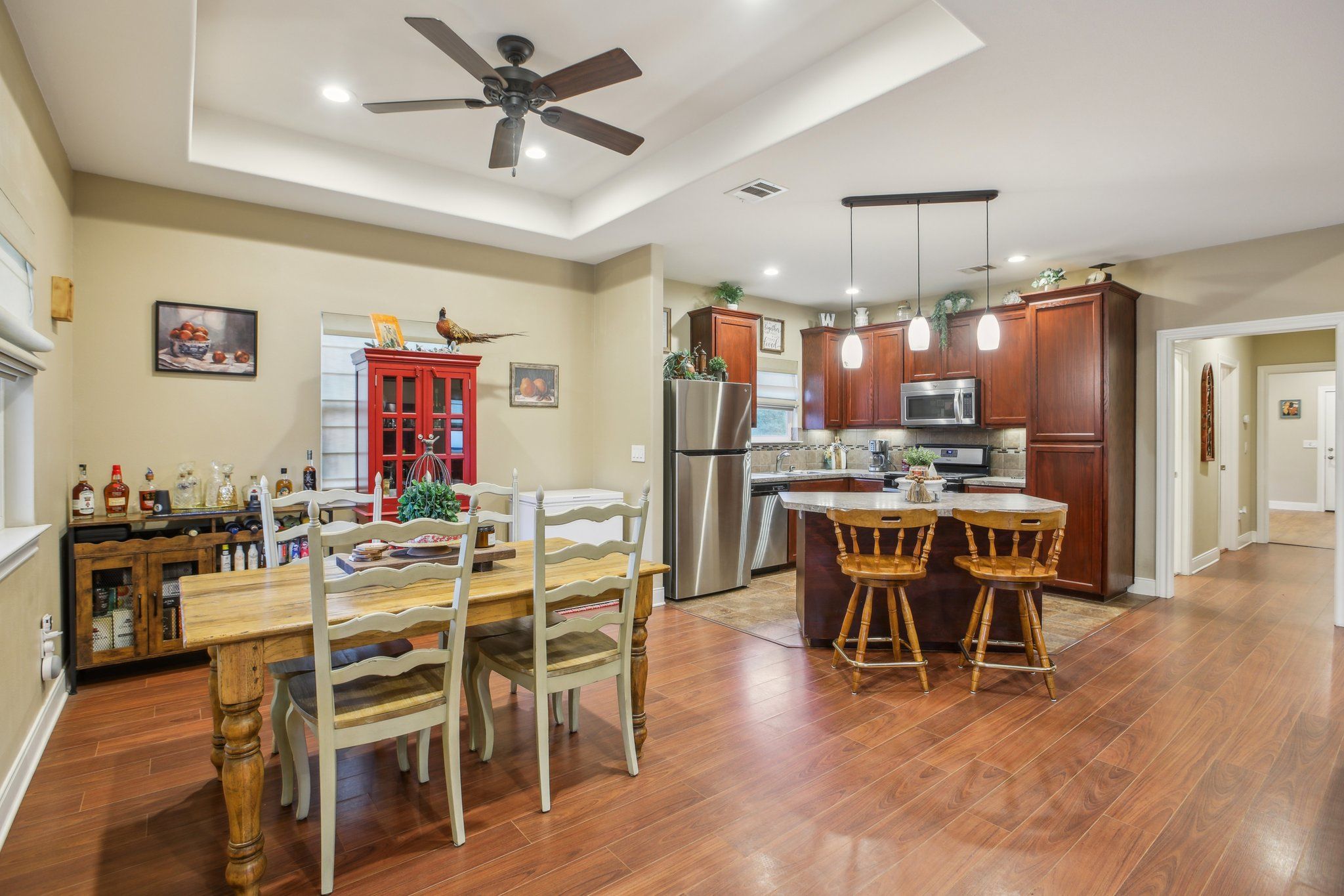 198 Kelley Road East Bastrop, TX 78602 - Photo 13 of 40 a view of a dining room with furniture and wooden floor