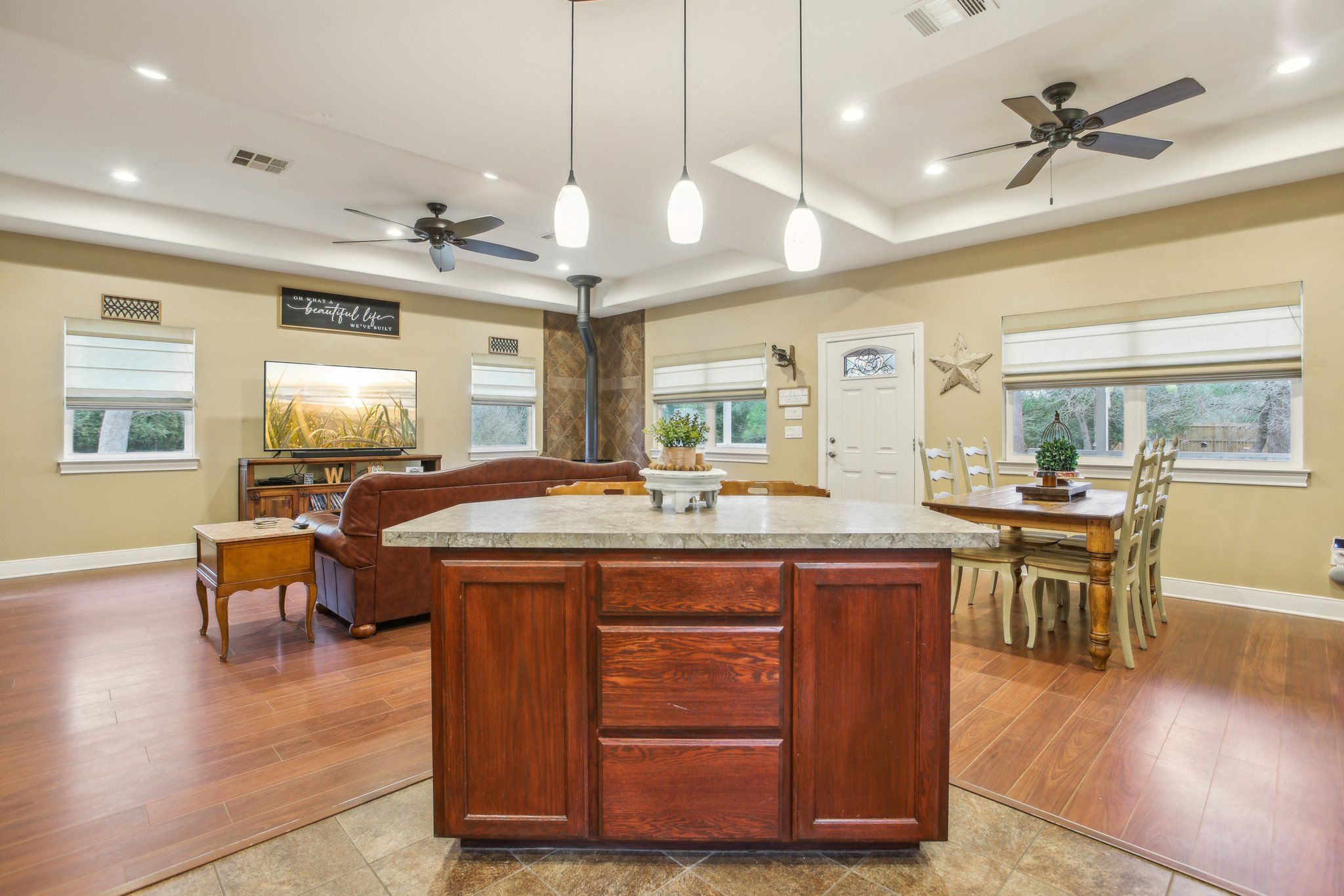 198 Kelley Road East Bastrop, TX 78602 - Photo 15 of 40 a view of a dining room with furniture window and wooden floor