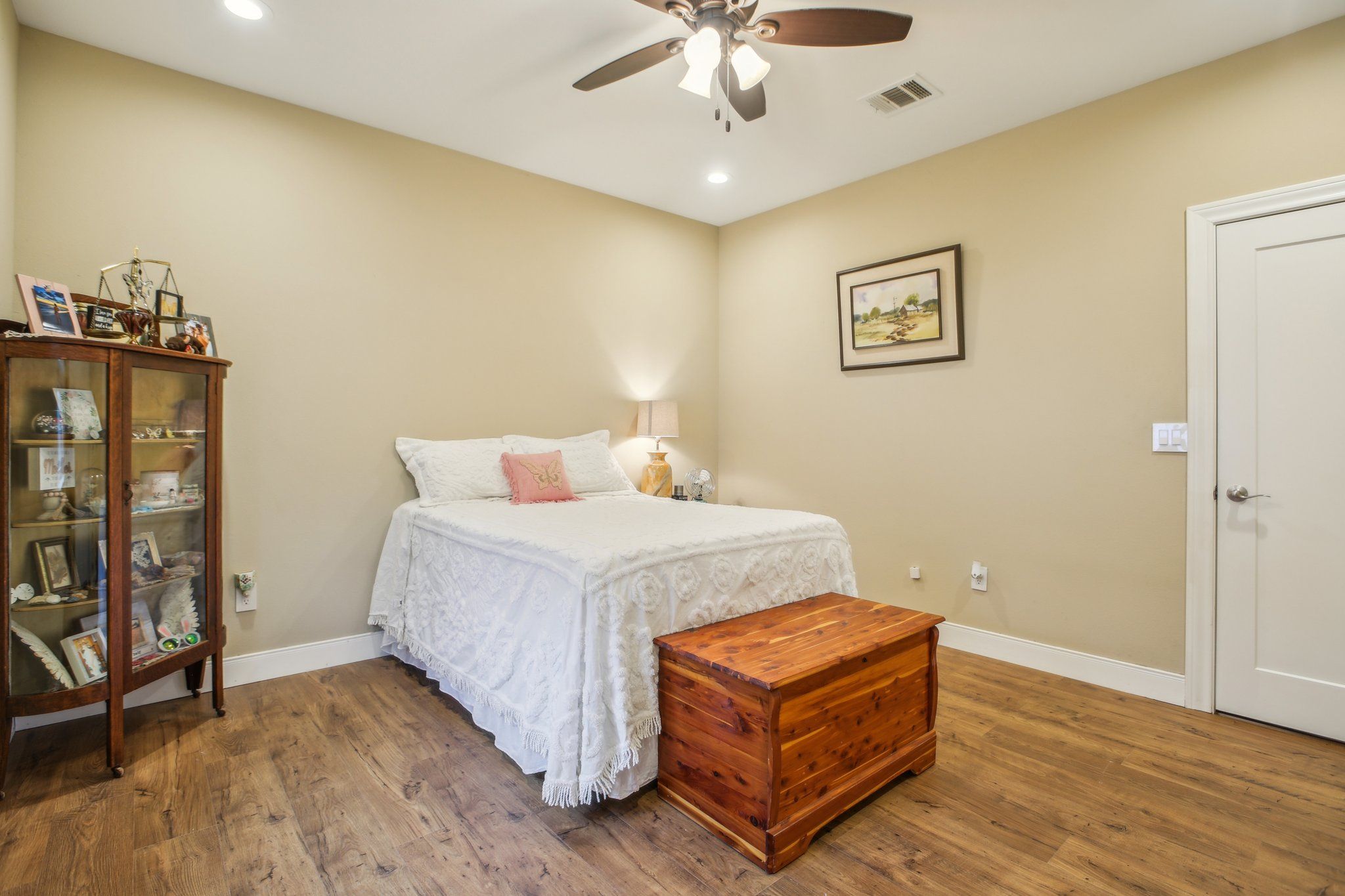 198 Kelley Road East Bastrop, TX 78602 - Photo 20 of 40 a bedroom with a bed and wooden floor