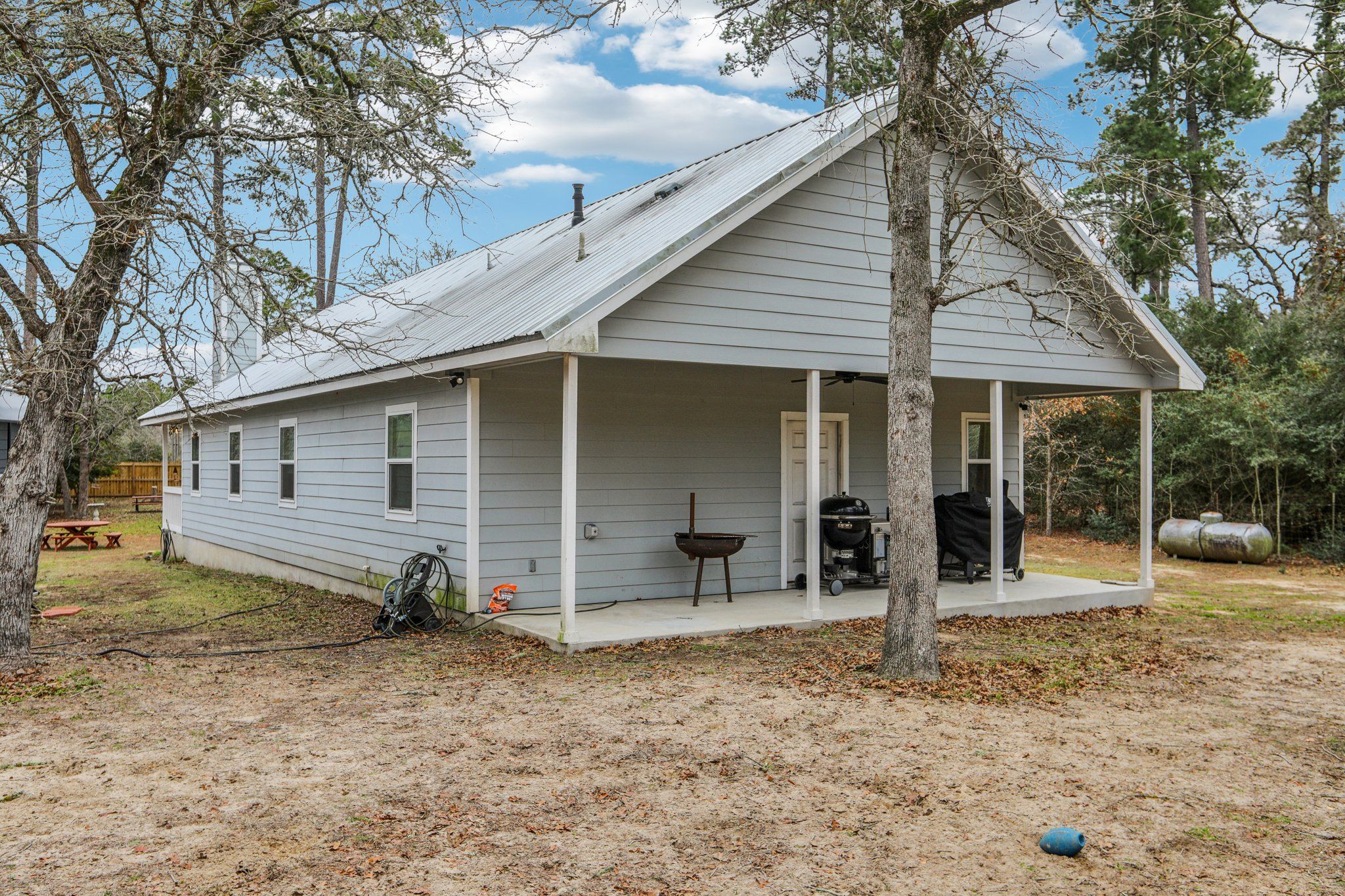 198 Kelley Road East Bastrop, TX 78602 - Photo 34 of 40 a view of a house with a yard and large tree