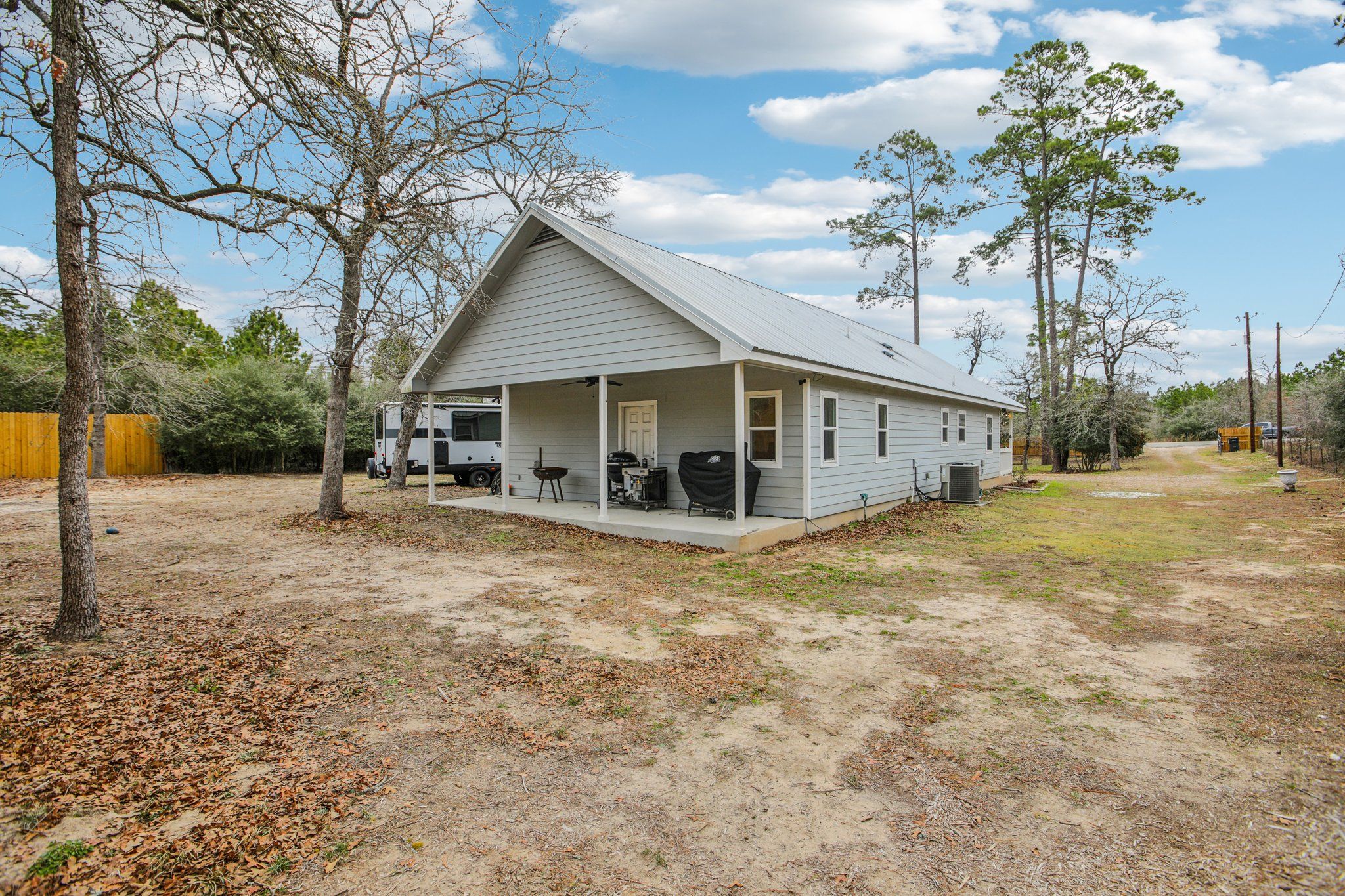 198 Kelley Road East Bastrop, TX 78602 - Photo 35 of 40 a view of a house with a backyard