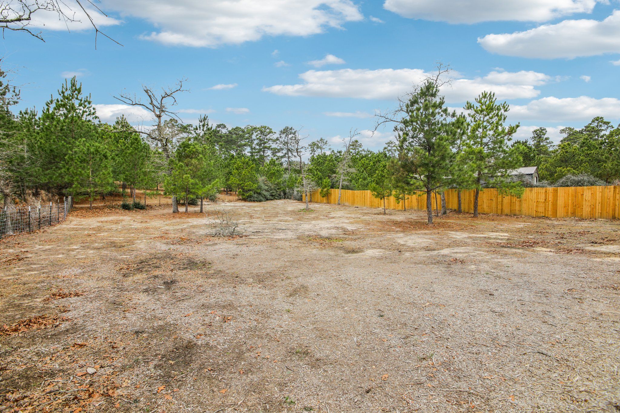 198 Kelley Road East Bastrop, TX 78602 - Photo 36 of 40 a backyard of a house with table and chairs