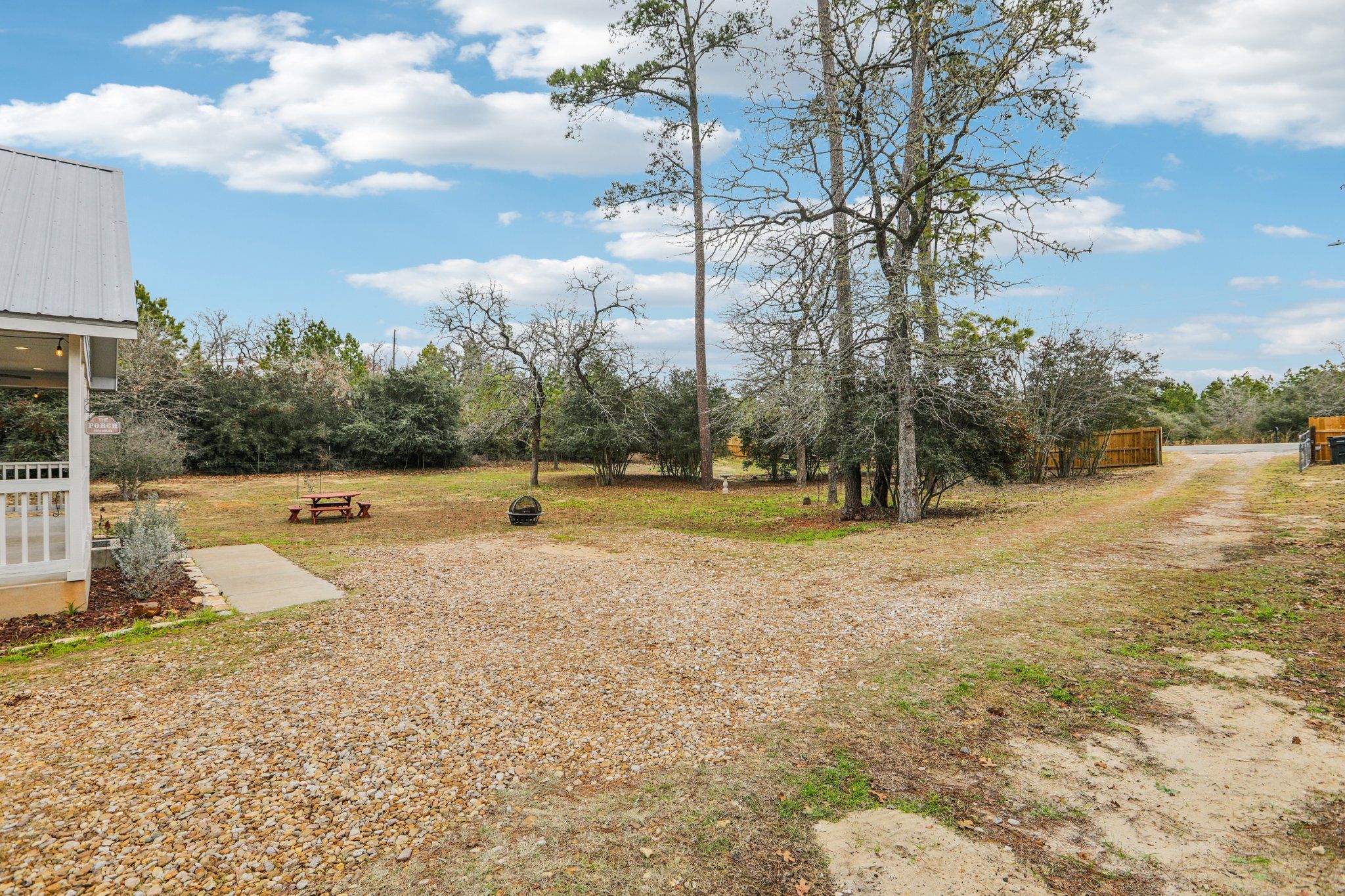 198 Kelley Road East Bastrop, TX 78602 - Photo 38 of 40 a view of a swimming pool with a yard and large trees
