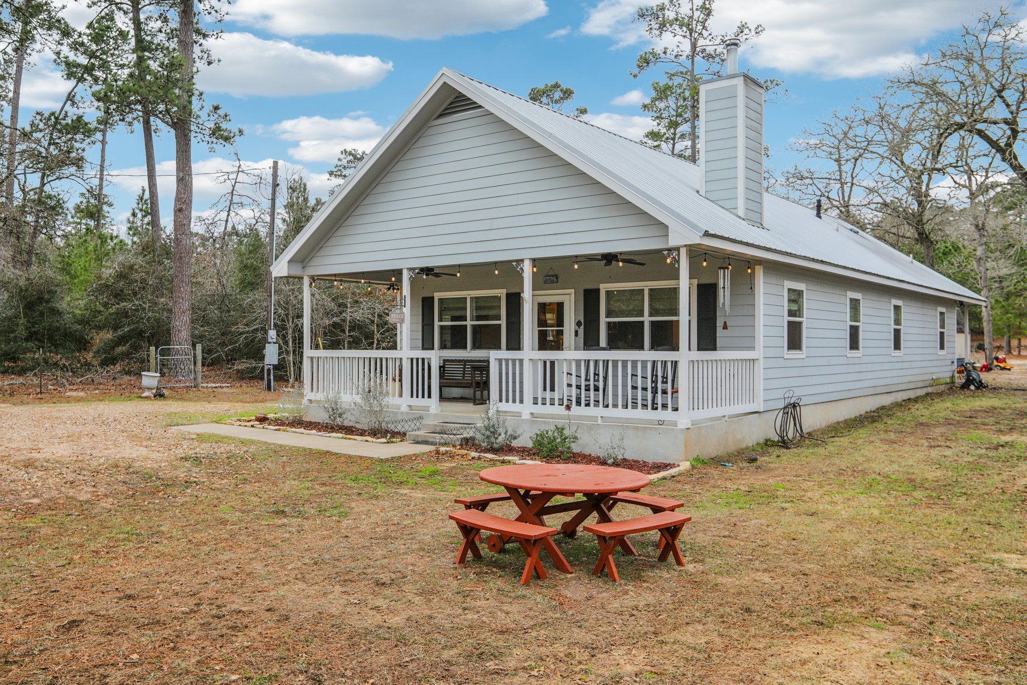 198 Kelley Road East Bastrop, TX 78602 - Photo 6 of 40 a backyard of a house with yard table and chairs