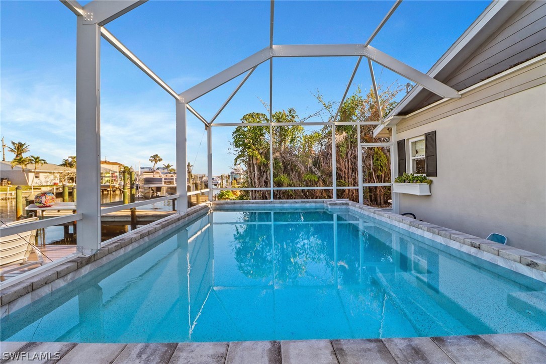 2574 Bayshore Drive Matlacha, FL 33993 - Photo 11 of 43 a view of a balcony with chairs