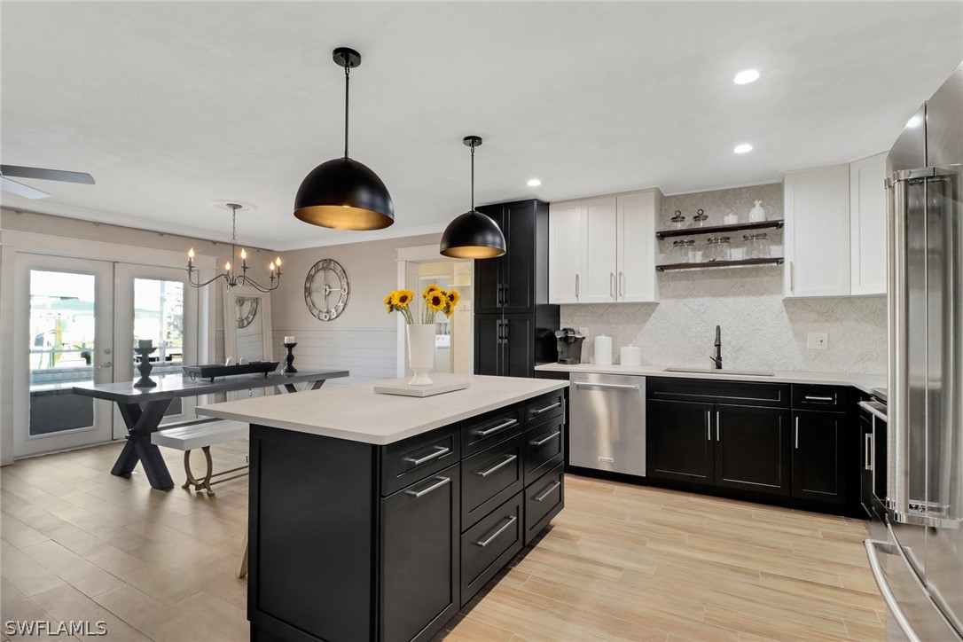 2574 Bayshore Drive Matlacha, FL 33993 - Photo 17 of 43 a kitchen with a stove and a refrigerator