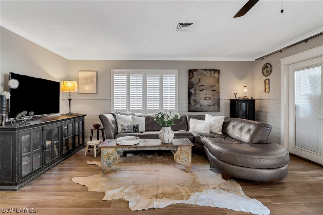 2574 Bayshore Drive Matlacha, FL 33993 - Photo 19 of 43 a living room with furniture and a flat screen tv