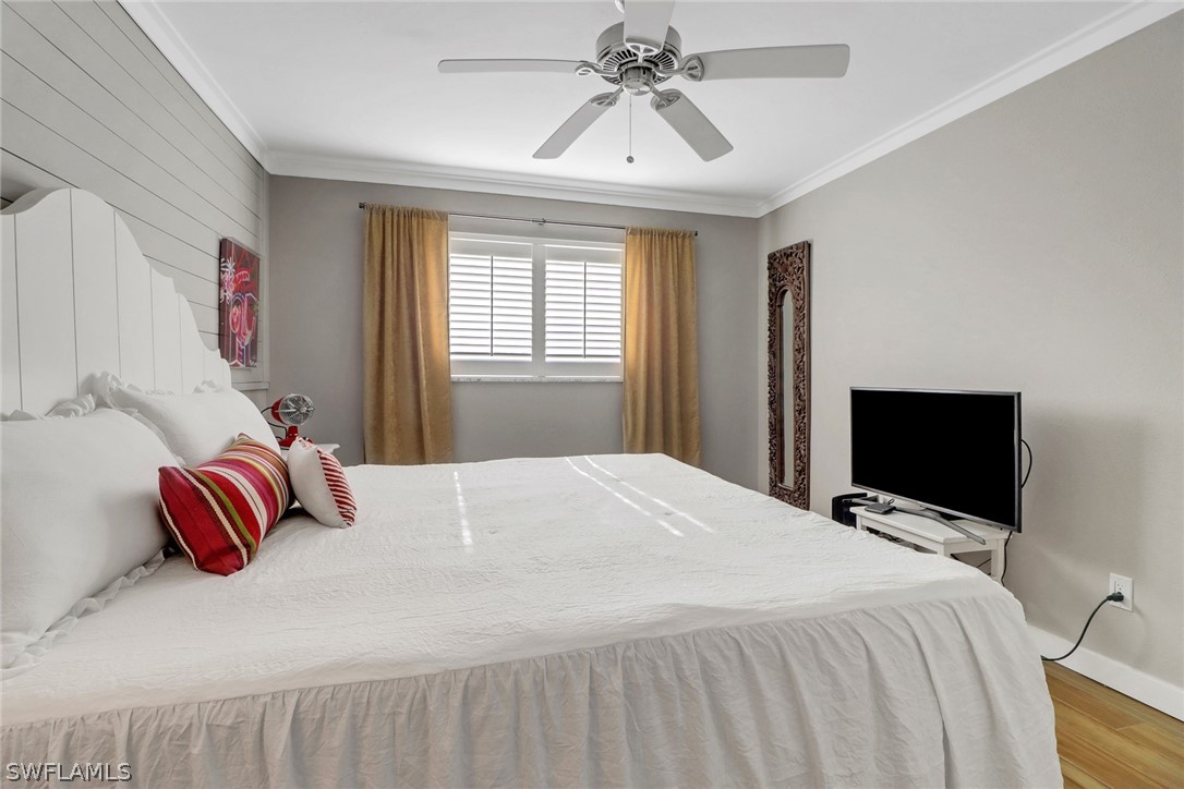 2574 Bayshore Drive Matlacha, FL 33993 - Photo 23 of 43 a bedroom with a bed and flat screen tv