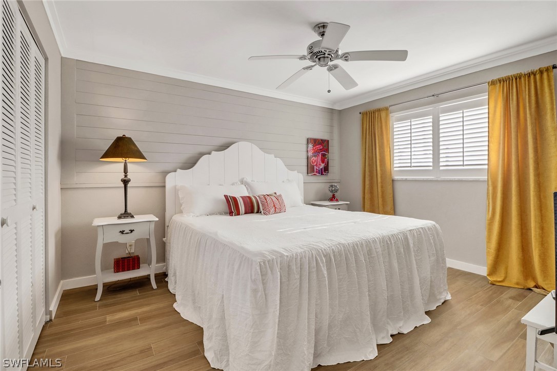 2574 Bayshore Drive Matlacha, FL 33993 - Photo 24 of 43 a bedroom with a bed and a chandelier