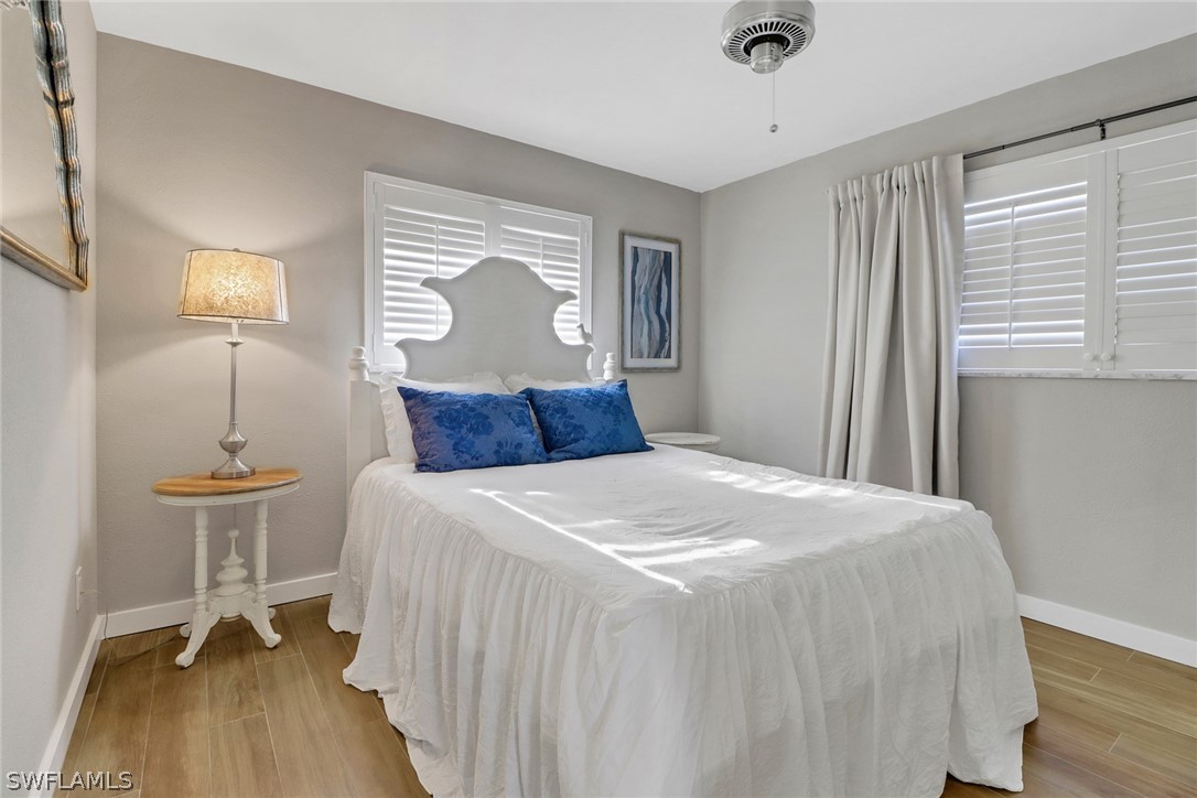 2574 Bayshore Drive Matlacha, FL 33993 - Photo 26 of 43 a bedroom with a bed and a table