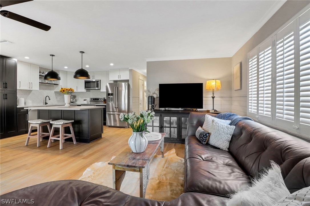 2574 Bayshore Drive Matlacha, FL 33993 - Photo 3 of 43 a living room with furniture and a flat screen tv