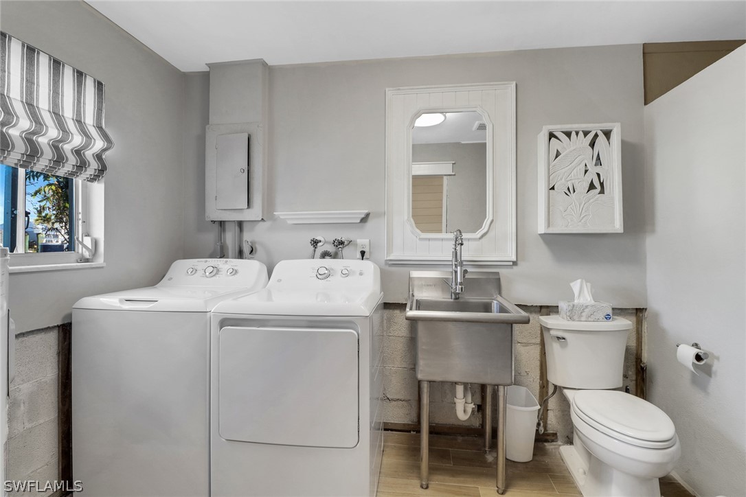 2574 Bayshore Drive Matlacha, FL 33993 - Photo 32 of 43 a bathroom with a sink toilet and mirror