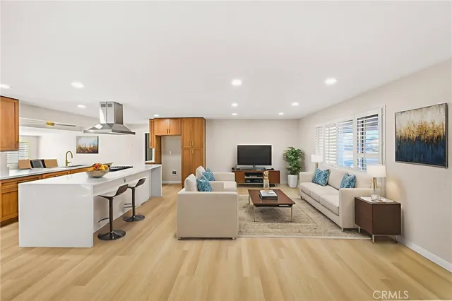 a view of a livingroom with a ceiling fan and window