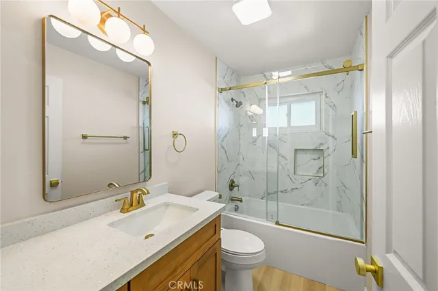 a view of a patio with table and chairs and potted plants