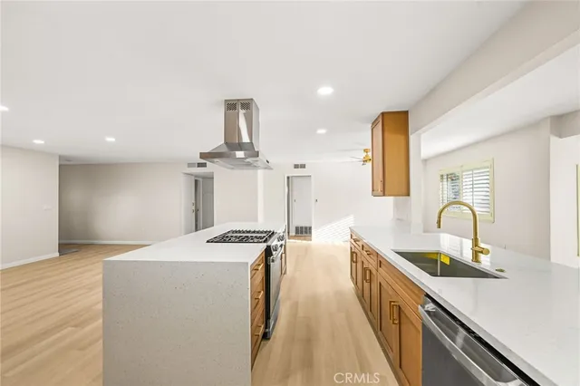 a view of kitchen and wooden floor