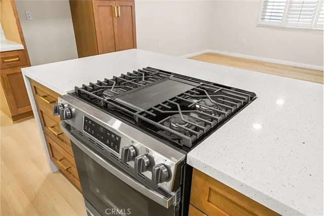 a living room with couches and a flat screen tv