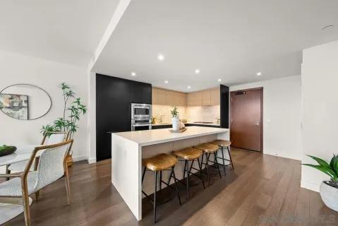 a large kitchen with a table and chairs