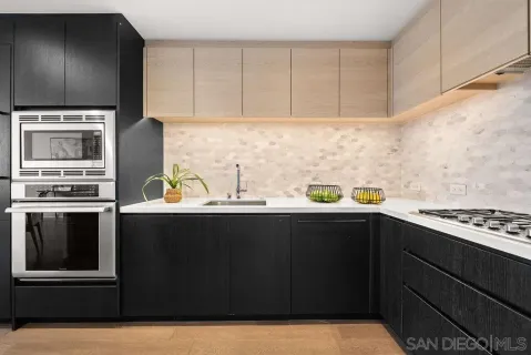 a kitchen with a sink and cabinets