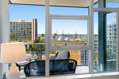 a balcony with table and chairs
