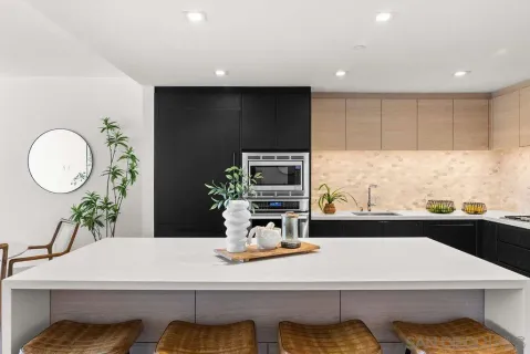 a kitchen with a sink a counter space and a window