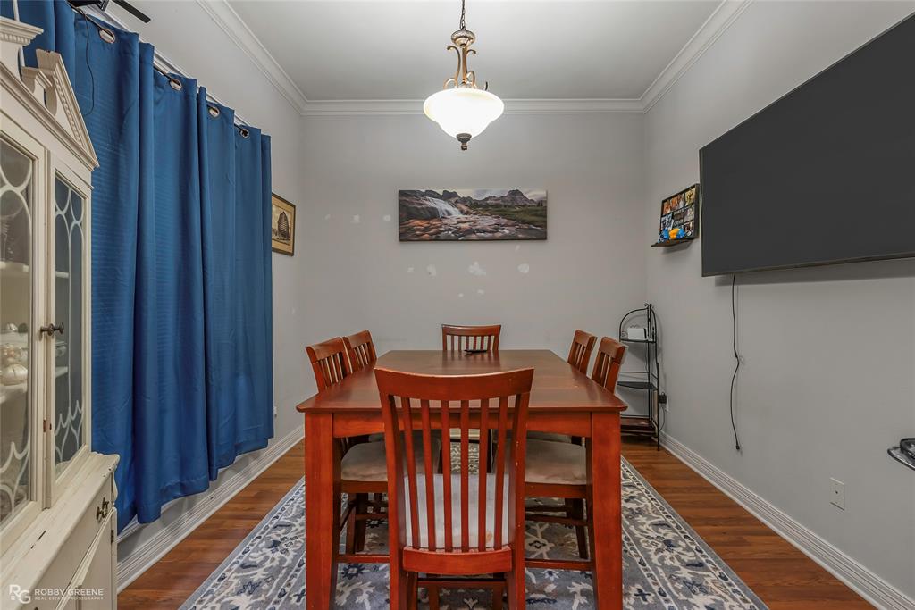12168 Highway 157 Princeton, LA 71067 - Photo 13 of 32 Dining area featuring ornamental molding and wood finished floors