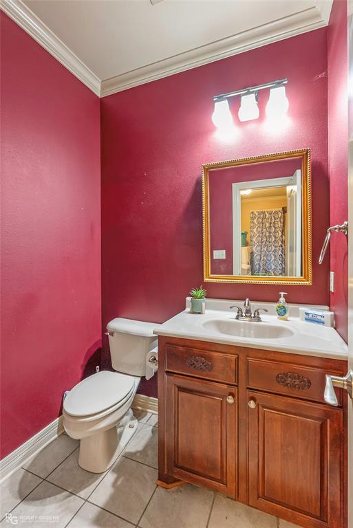 12168 Highway 157 Princeton, LA 71067 - Photo 22 of 32 Bathroom with crown molding, vanity, a shower with curtain, and light tile patterned floors