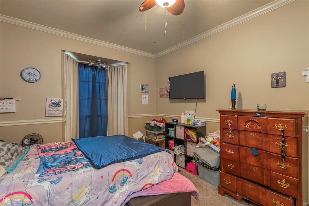 12168 Highway 157 Princeton, LA 71067 - Photo 25 of 32 Bedroom featuring crown molding, carpet flooring, and ceiling fan
