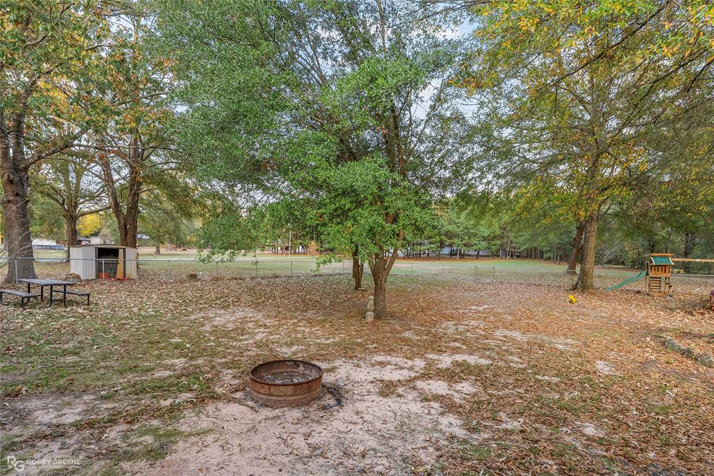 12168 Highway 157 Princeton, LA 71067 - Photo 6 of 32 View of yard with a playground
