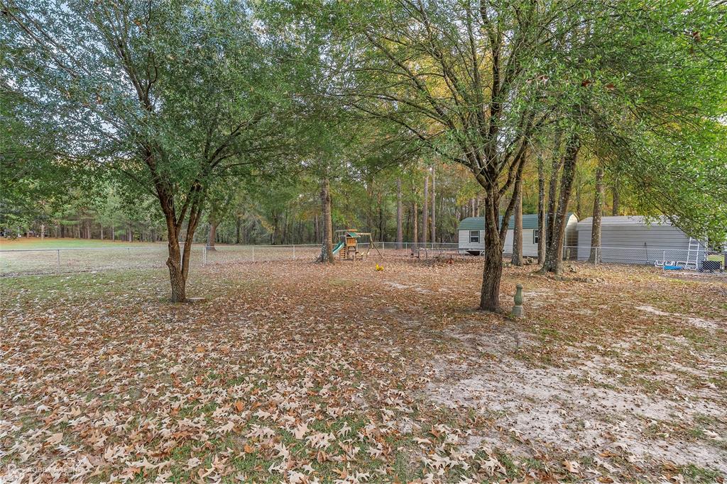 12168 Highway 157 Princeton, LA 71067 - Photo 8 of 32 View of yard featuring a playground