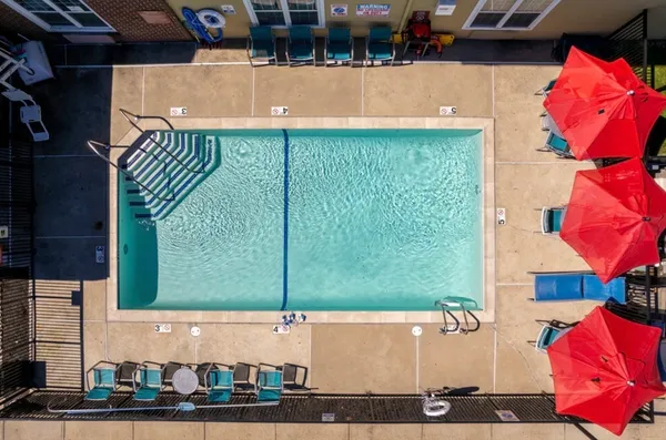a view of swimming pool with outdoor seating