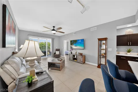 a living room with furniture fireplace and a flat screen tv
