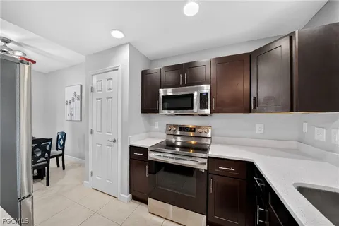 a kitchen with a refrigerator stove and sink
