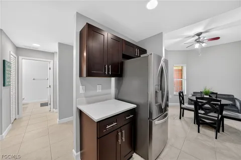 a kitchen with stainless steel appliances a refrigerator and a stove