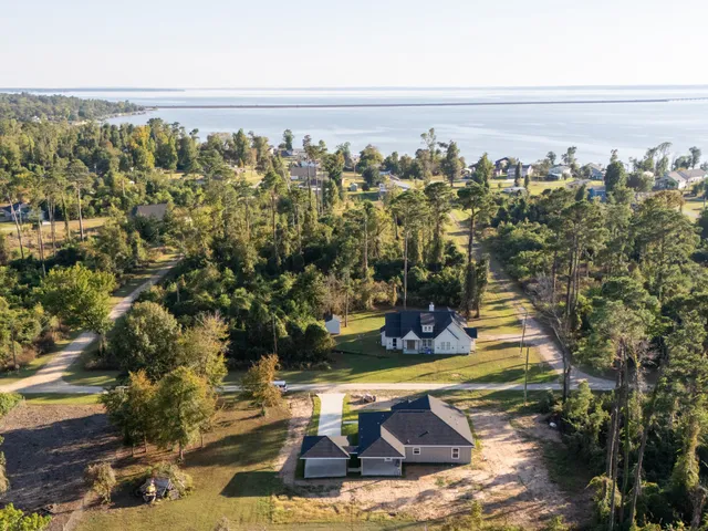 a view of a swimming pool with a yard