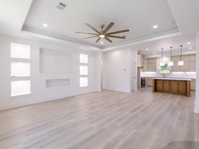 a view of a kitchen with a sink and a window