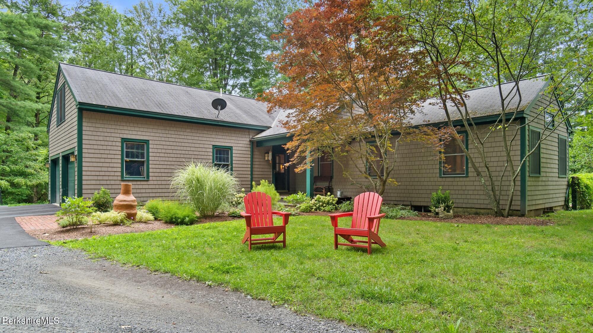 30 Lake Mansfield Road Great Barrington, MA 01230 - Photo 2 of 35 a backyard of a house with seating space