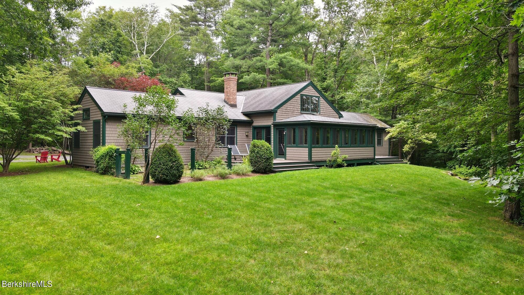 30 Lake Mansfield Road Great Barrington, MA 01230 - Photo 3 of 35 a front view of a house with a garden