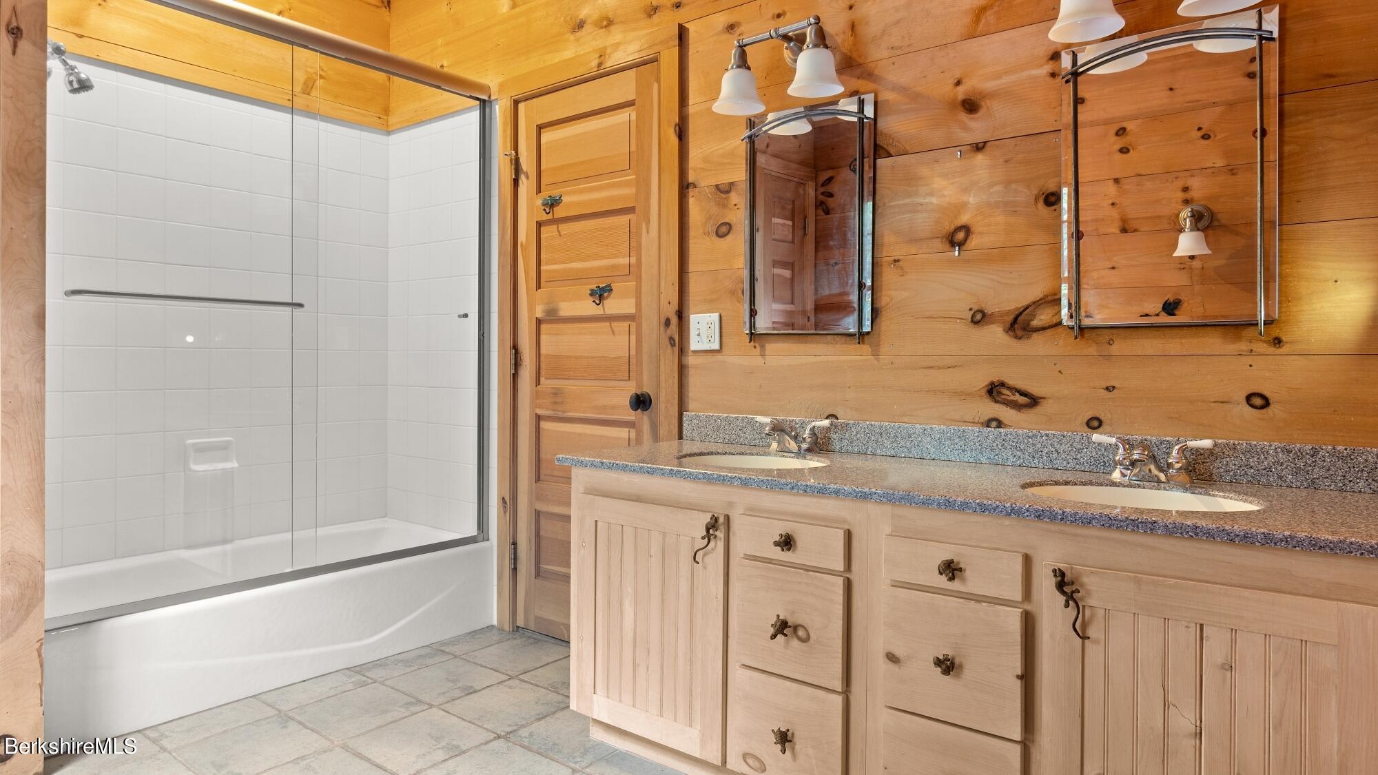 30 Lake Mansfield Road Great Barrington, MA 01230 - Photo 23 of 35 a bathroom with a granite countertop sink two mirror and a bathtub