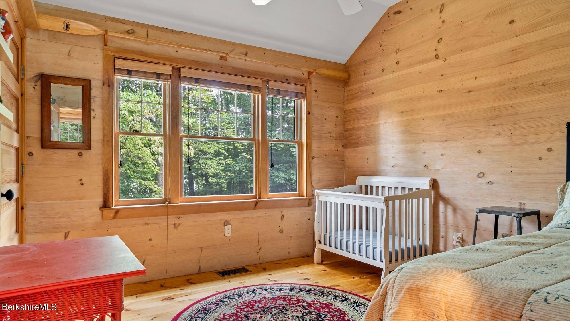 30 Lake Mansfield Road Great Barrington, MA 01230 - Photo 24 of 35 a bedroom with a bed and a window