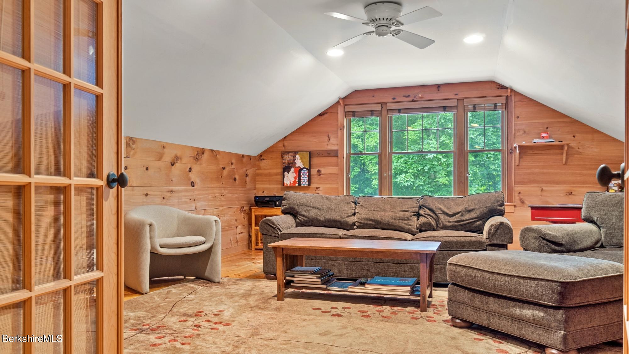 30 Lake Mansfield Road Great Barrington, MA 01230 - Photo 25 of 35 a living room with furniture and a large window