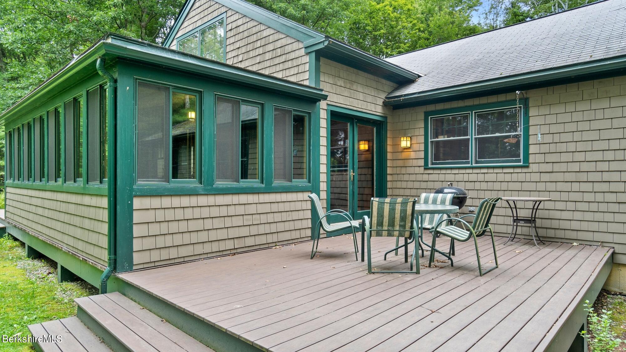 30 Lake Mansfield Road Great Barrington, MA 01230 - Photo 30 of 35 a view of a wooden deck with chairs