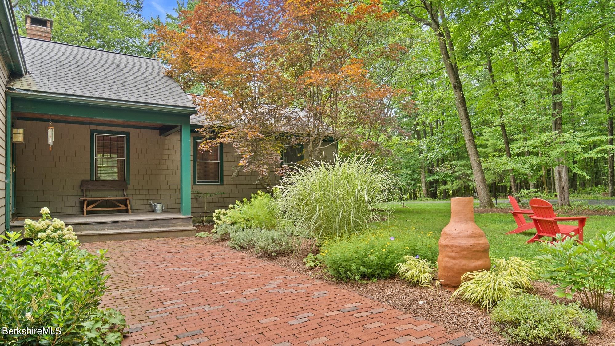 30 Lake Mansfield Road Great Barrington, MA 01230 - Photo 4 of 35 a front view of a house with garden