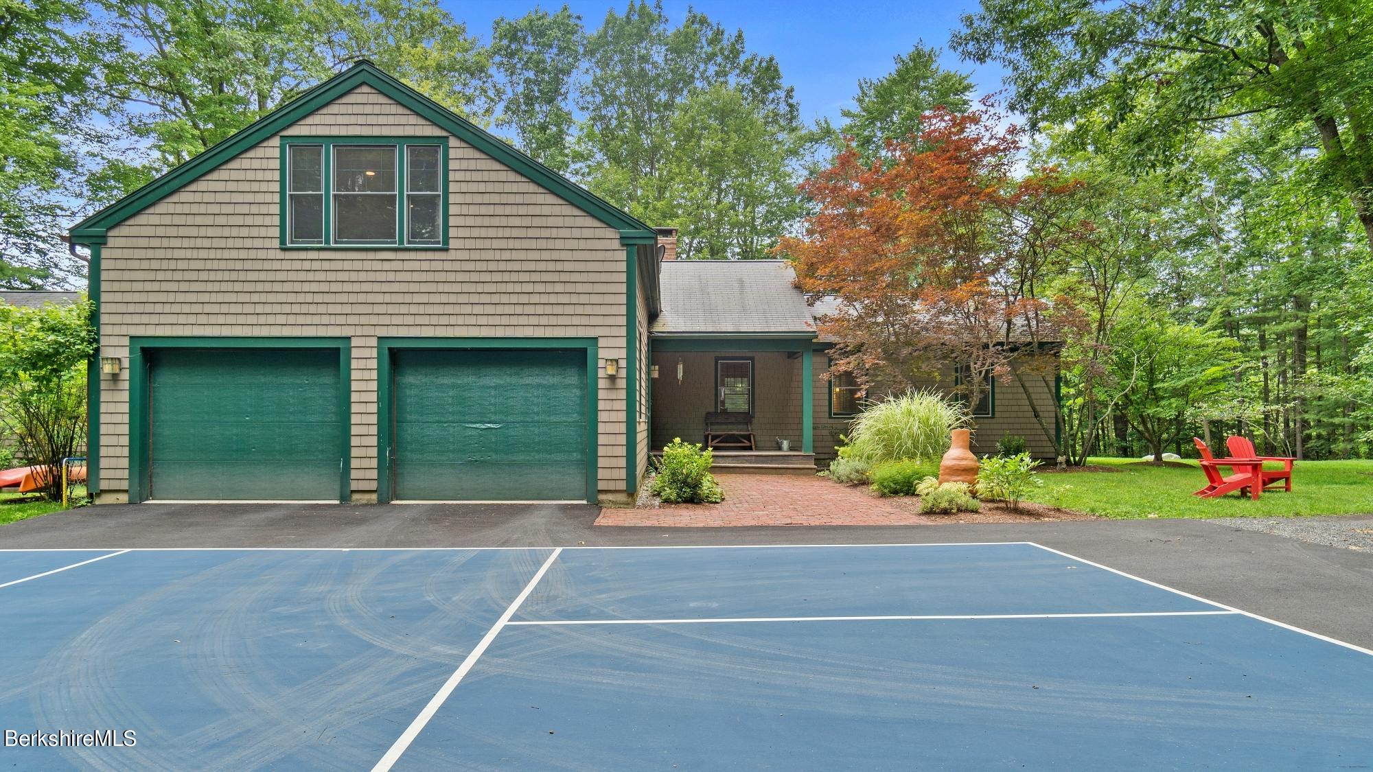 30 Lake Mansfield Road Great Barrington, MA 01230 - Photo 32 of 35 a front view of a house with a yard and a garage