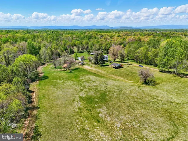 a view of a lake with a yard