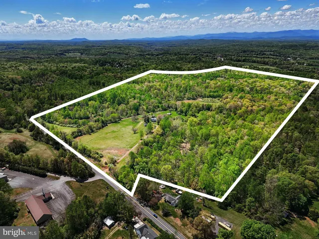 a view of a balcony with an outdoor seating